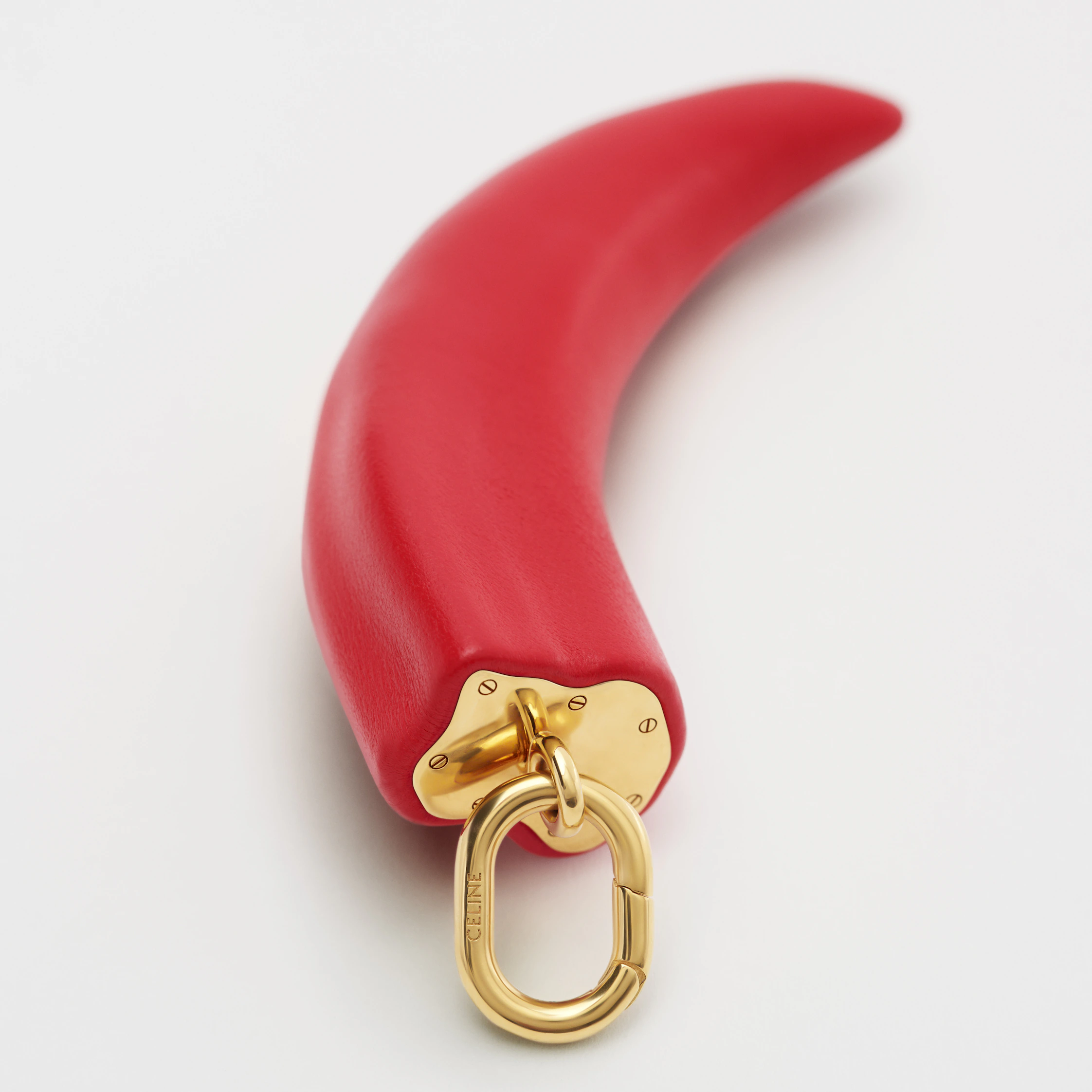 CHARMS SMALL HORN IN RESIN, LEATHER AND BRASS WITH GOLD FINISH