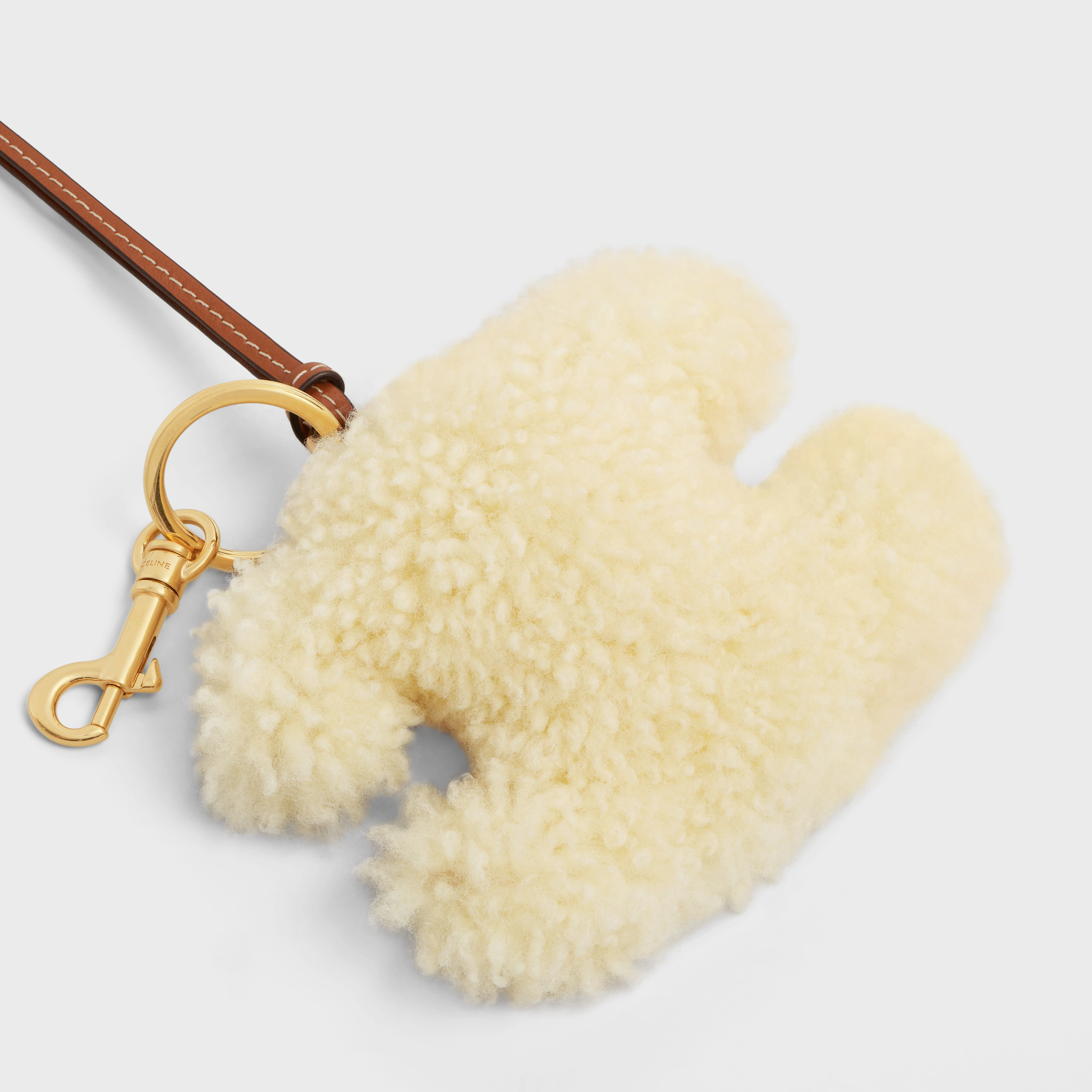 TRIOMPHE pom-pom keyring in SHEARLING AND SMOOTH CALFSKIN with Gold Finishing