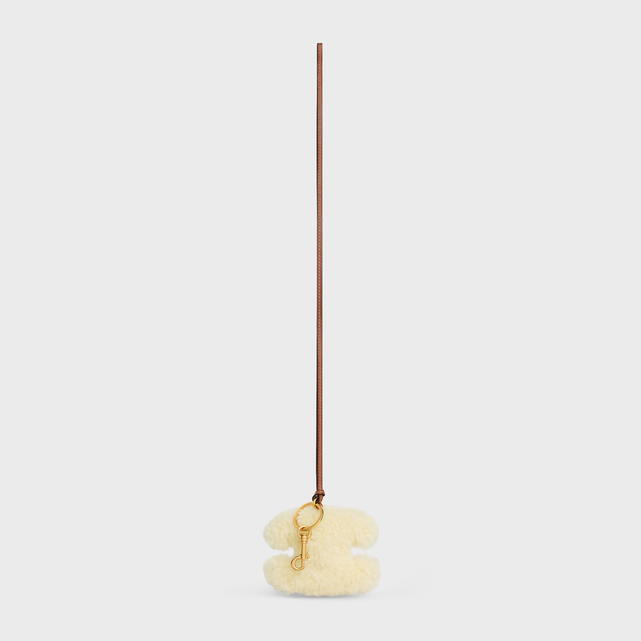 TRIOMPHE pom-pom keyring in SHEARLING AND SMOOTH CALFSKIN with Gold Finishing