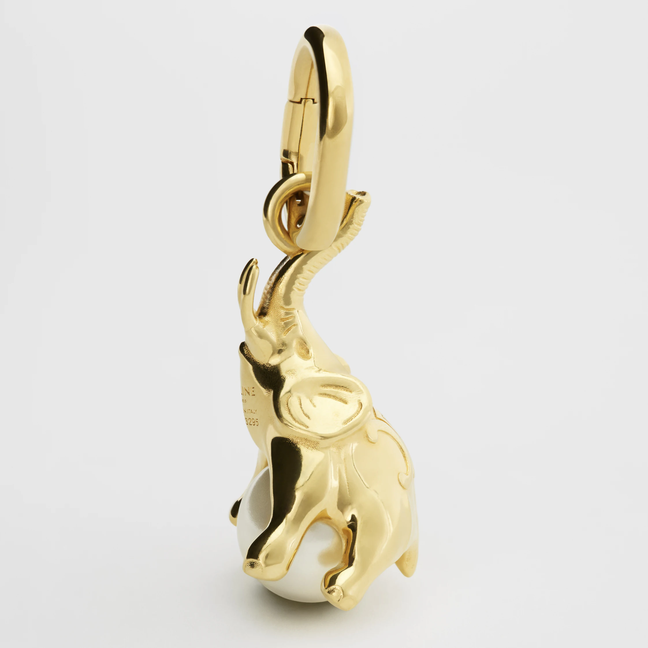CHARMS ELEPHANT ON PEARL IN BRASS WITH GOLD FINISH AND RESIN PEARL