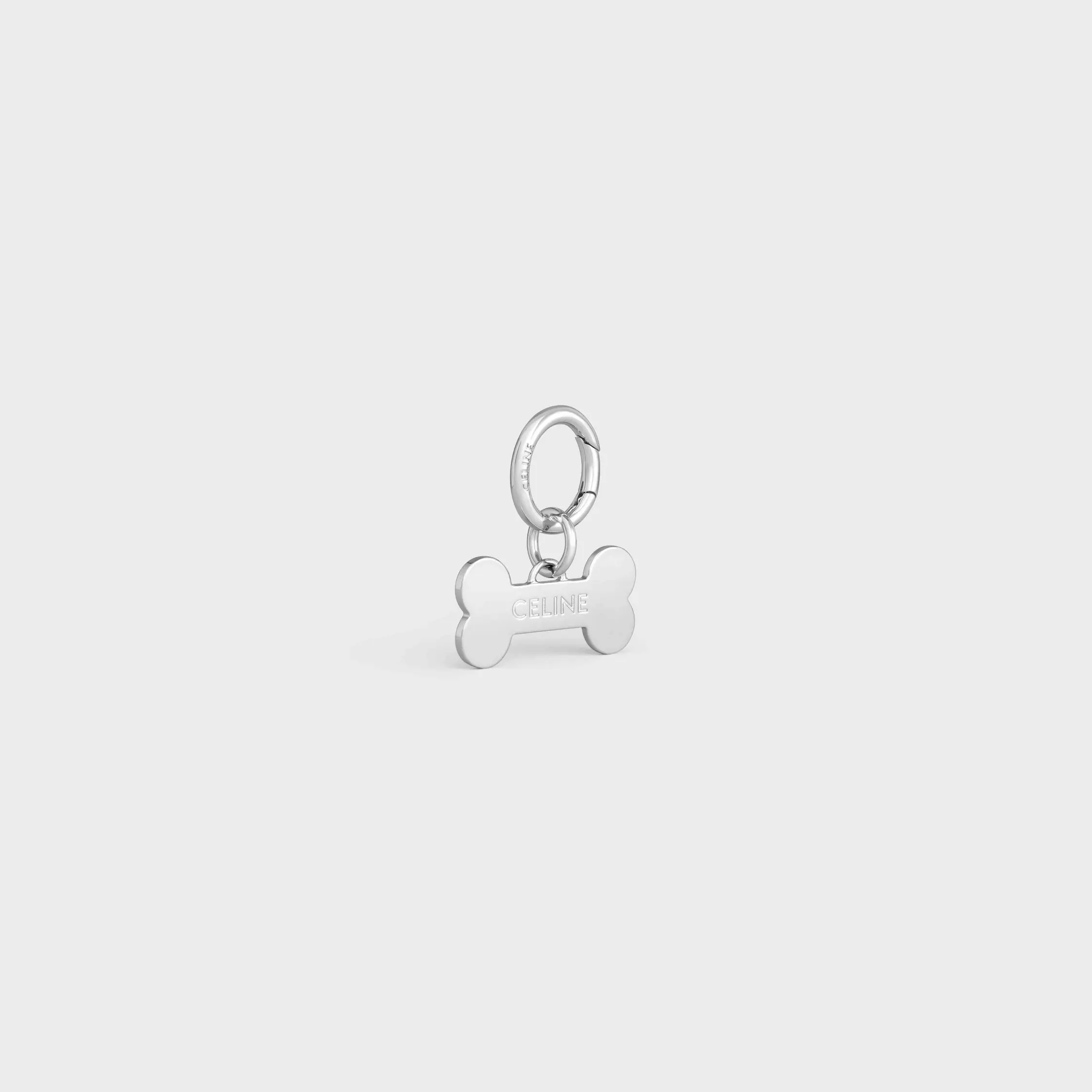 Bone dog medal in brass
